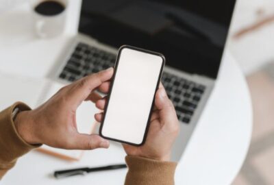 Man holding a phone | attention economy