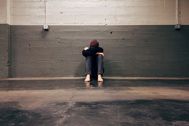 man with head in hands