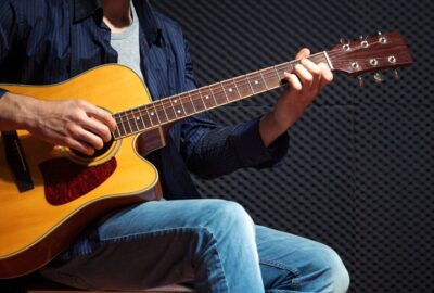 man playing guitar | power of consistency