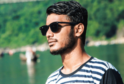 advice for young men | man with sunglasses looking