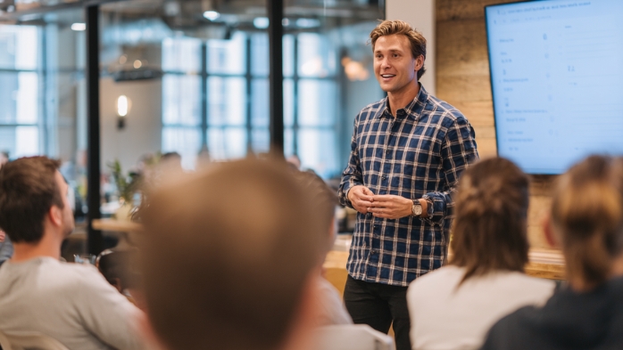 young startup founder delivering a minimum viable product to a group of investors | advice for graduates